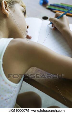 Preteen girl writing in notebook View Large Photo Image Stock Photography - Preteen girl writing in notebook. Fotosearch