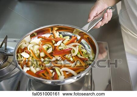 SautŽing vegetables View Large Photo Image Stock Image - SautŽing vegetables. Fotosearch