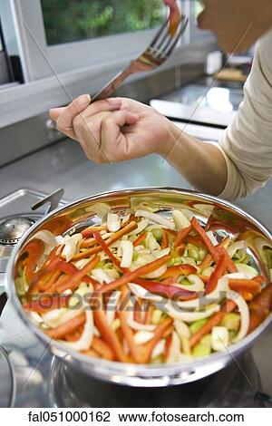 SautŽing vegetables View Large Photo Image Stock Image - SautŽing vegetables. Fotosearch