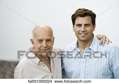 Picture - Senior man with adult son, portrait. Fotosearch