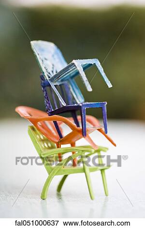Stacked toy chairs View Large Photo Image Stock Photo - Stacked toy chairs. Fotosearch