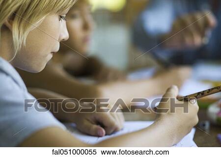 Student writing classwork assignment View Large Photo Image Stock Photography - Student writing classwork assignment. Fotosearch