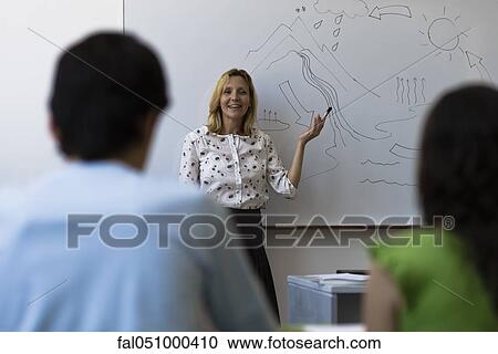 Teacher teaching high school class View Large Photo Image Stock Image - Teacher teaching high school class. Fotosearch