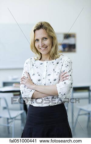 Teacher with arms folded, portrait View Large Photo Image Stock Image - Teacher with arms folded, portrait. Fotosearch