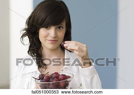 Teenage girl eating grapes View Large Photo Image Stock Image - Teenage girl eating grapes. Fotosearch