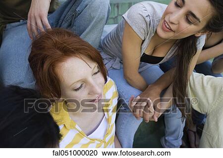 Teenage girl hanging out with her friends View Large Photo Image Stock Image - Teenage girl hanging out with her friends. Fotosearch