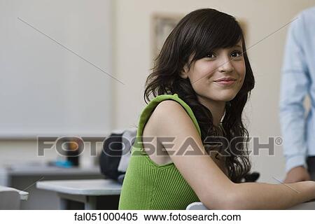 Teenage girl in high school classroom View Large Photo Image Stock Photography - Teenage girl in high school classroom. Fotosearch
