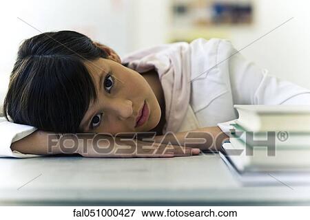 Teenage girl taking break from studies View Large Photo Image Stock Photo - Teenage girl taking break from studies. Fotosearch