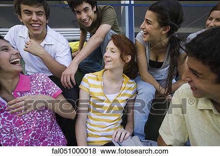 Teenagers hanging out together, all laughing View Large Photo Image Stock Photo - Teenagers hanging out together, all laughing. Fotosearch