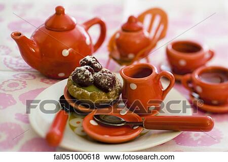 Toy tea set with pastry View Large Photo Image Stock Photo - Toy tea set with pastry. Fotosearch