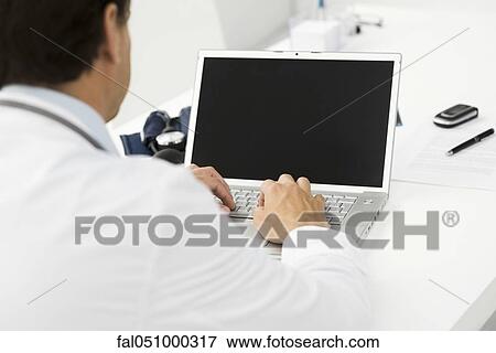 Using laptop computer View Large Photo Image Stock Photo - Using laptop computer. Fotosearch
