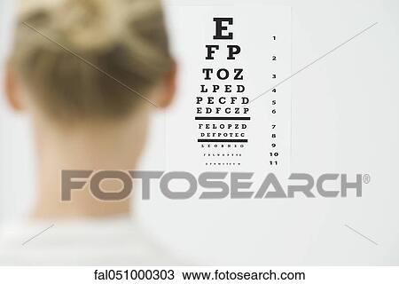 Woman taking eye exam View Large Photo Image Stock Image - Woman taking eye exam. Fotosearch