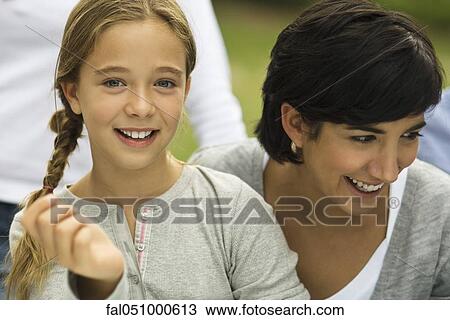 Young girl with mother, portrait View Large Photo Image Stock Image - Young girl with mother, portrait. Fotosearch