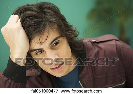 Young man contemplating View Large Photo Image Stock Photo - Young man contemplating. Fotosearch