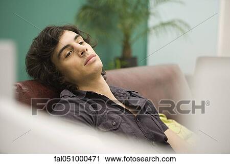 Young man daydreaming View Large Photo Image Stock Image - Young man daydreaming. Fotosearch