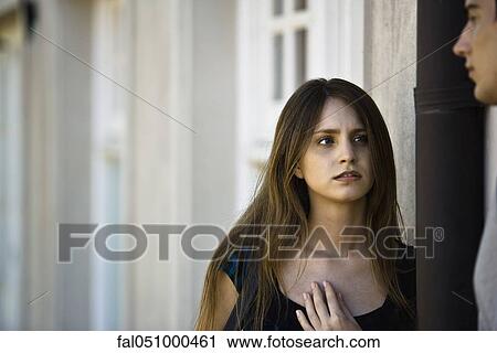 Young woman in serious conversation with boyfriend View Large Photo Image Stock Image - Young woman in serious conversation with boyfriend. Fotosearch