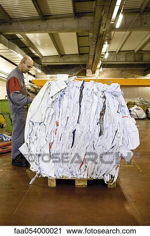 A machinist writes weight on a bale of PVC sheeting after weighing it View Large Photo Image Stock Image - A machinist writes weight on a bale of PVC sheeting after weighing it. Fotosearch