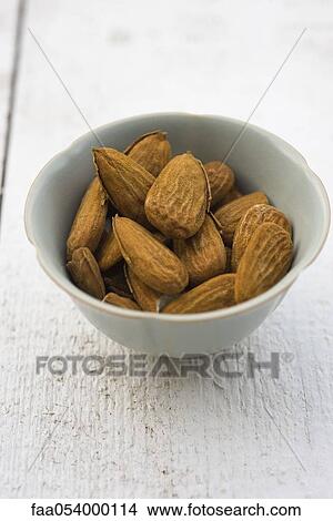 Picture - Almonds in bowl. Fotosearch