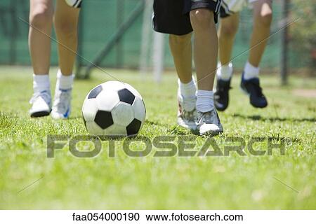 Children playing soccer, cropped View Large Photo Image Stock Image - Children playing soccer, cropped. Fotosearch