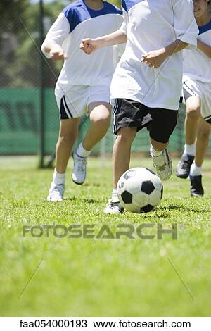 Children playing soccer, cropped View Large Photo Image Stock Image - Children playing soccer, cropped. Fotosearch
