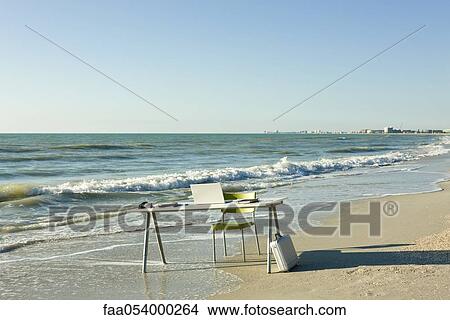 Desk and laptop computer on beach View Large Photo Image Picture - Desk and laptop computer on beach. Fotosearch