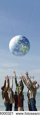 Ecology concept, group of people saving the earth together View Large Photo Image Stock Image - Ecology concept, group of people saving the earth together. Fotosearch