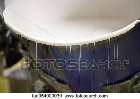 Stock Photo - Fabric coating plant, metal drum containing a liquid plasticizer used for coating textiles. Fotosearch