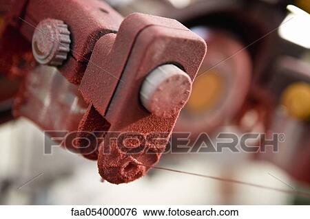 Stock Photograph - Fabric coating plant, recyclable composite textile weaving department, loom. Fotosearch