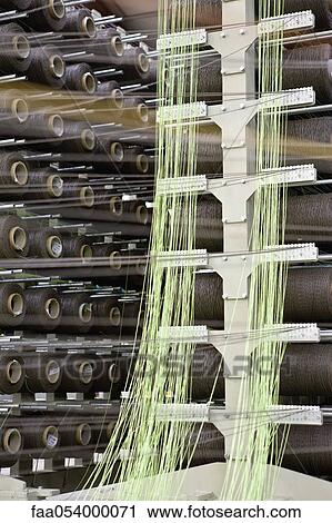 Fabric coating plant, weaving department, unwinding creel View Large Photo Image Stock Image - Fabric coating plant, weaving department, unwinding creel. Fotosearch