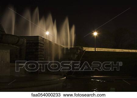 Stock Image - Fountain illuminated at night, Paris, France. Fotosearch