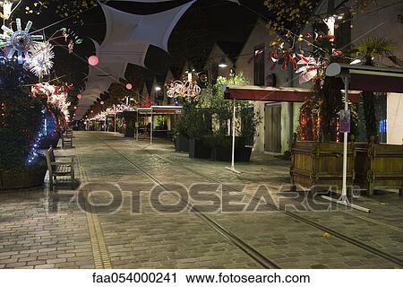 Stock Image - France, Paris, Bercy Village at night. Fotosearch