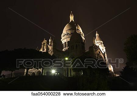 Stock Photo - France, Paris, Montmartre, view of Sacre Coeur at night. Fotosearch