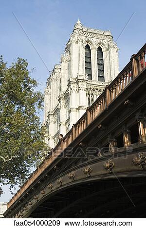 Stock Photo - France, Paris, Pont au Double and Notre Dame Cathedral. Fotosearch