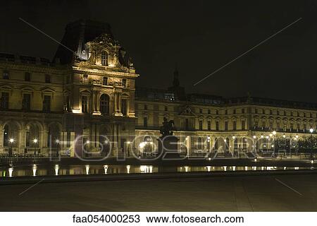 Stock Image - France, Paris, The Louvre at night. Fotosearch
