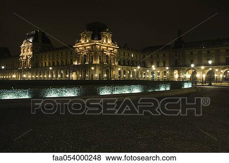 Stock Photo - France, Paris, The Louvre at night. Fotosearch