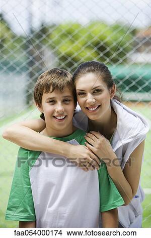 Mother and son outdoors, portrait View Large Photo Image Picture - Mother and son outdoors, portrait. Fotosearch