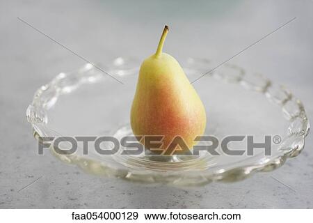 Stock Photo - Pear on plate. Fotosearch