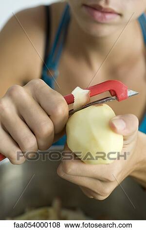 Stock Photo - Peeling potato. Fotosearch