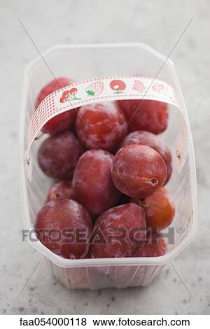 Plums in plastic container View Large Photo Image Stock Photo - Plums in plastic container. Fotosearch