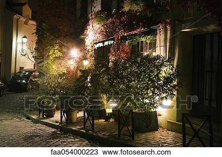 Potted plants on sidewalk at night, Paris, France View Large Photo Image Stock Image - Potted plants on sidewalk at night, Paris, France. Fotosearch