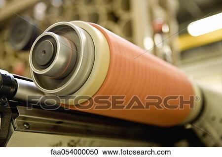 Stock Image - Recyclable composite textile fabrication department of factory, thread coating machine. Fotosearch
