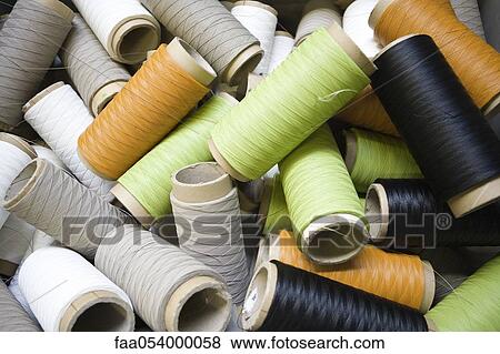 Recyclable composite textile fabrication department of factory, reels of excess coated thread View Large Photo Image Stock Photo - Recyclable composite textile fabrication department of factory, reels of excess coated thread. Fotosearch