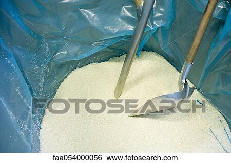 Stock Photograph - Recyclable composite textile fabrication department of factory, PVC granules for coating thread. Fotosearch