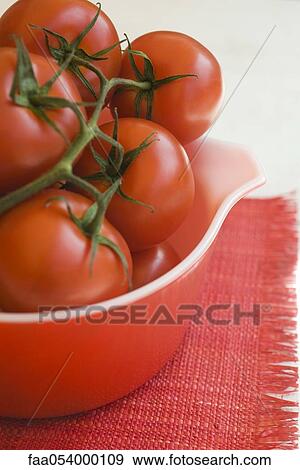 Ripe vine tomatoes in bowl View Large Photo Image Stock Photo - Ripe vine tomatoes in bowl. Fotosearch