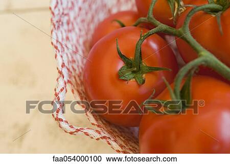 Vine tomatoes View Large Photo Image Stock Image - Vine tomatoes. Fotosearch