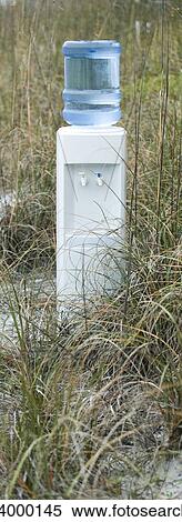 Water cooler in field of dry grass View Large Photo Image Stock Photography - Water cooler in field of dry grass. Fotosearch