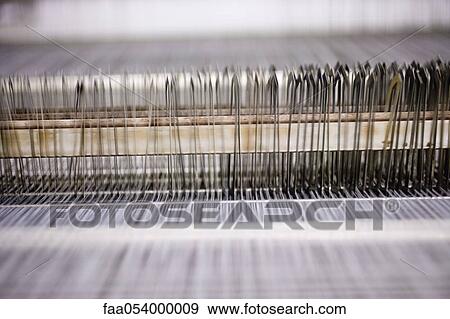 Stock Photo - Weaving mill, lap of threads on loom. Fotosearch