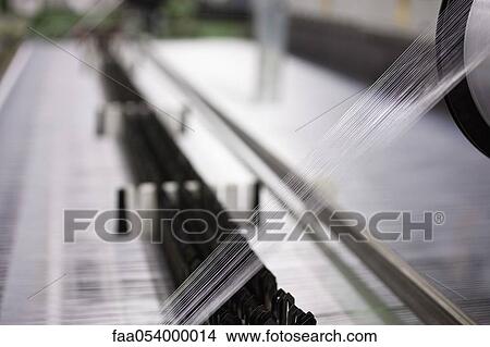 Weaving mill, thread on loom View Large Photo Image Picture - Weaving mill, thread on loom. Fotosearch