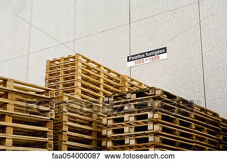 Stock Photo - Wood pallets stored at industrial plant. Fotosearch
