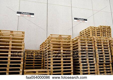 Stock Photograph - Wood pallets stored at industrial plant. Fotosearch